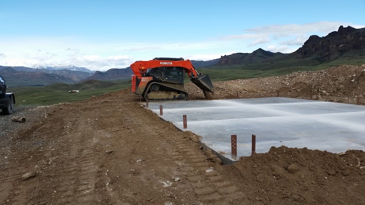 Skid Steer and concrete pad